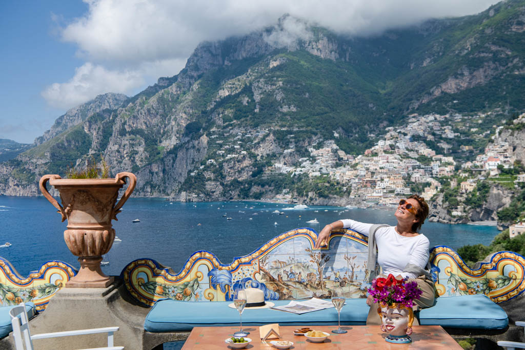 Woman having an aperitiv in the terrace of Hotel Il San Pietro di Positano,Relais &amp; Chateaux on the Amalfi coast