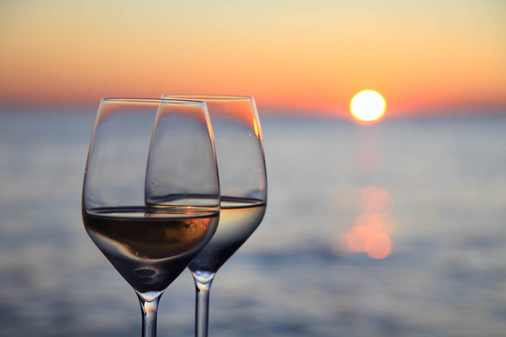 Glasses of wine against red sunset-Rovinj-Croatia