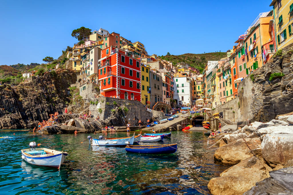 View of the village Riomaggiore. Cinque Terre National Park, at summer with tourists in Liguria Italy
