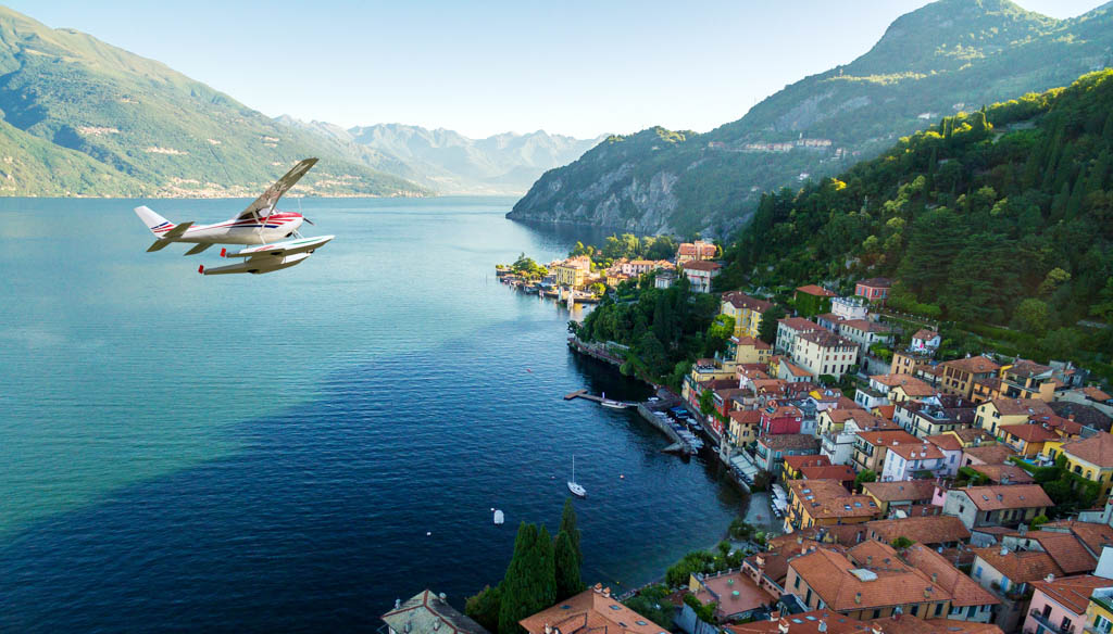 Seaplane flying over Varenna - Lake Como, Italy