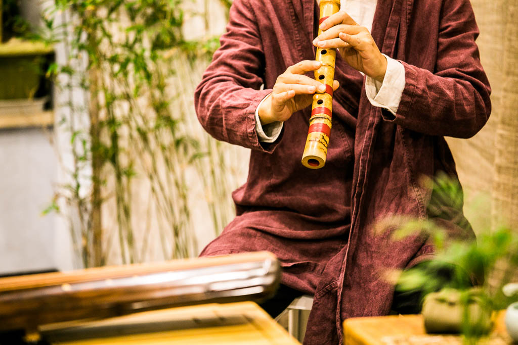 Japanede Man Playing a Traditional Flute