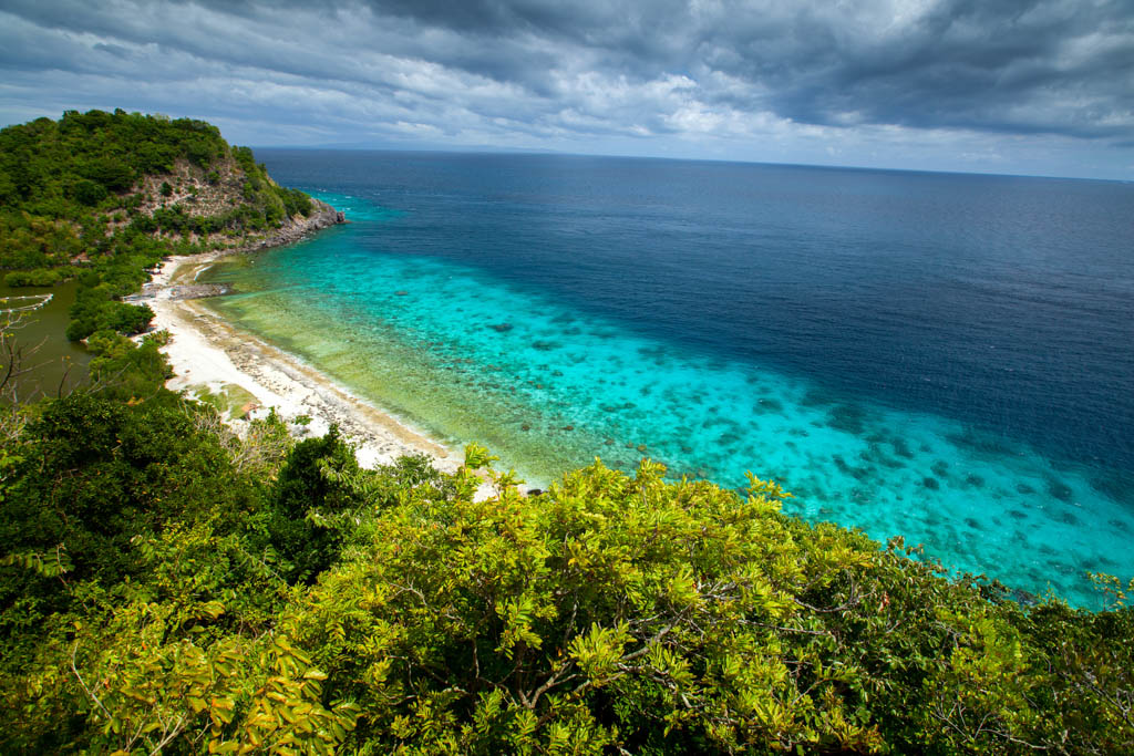 View from top of a hill to Apo Reef Natural Park. Apo island, Philippines