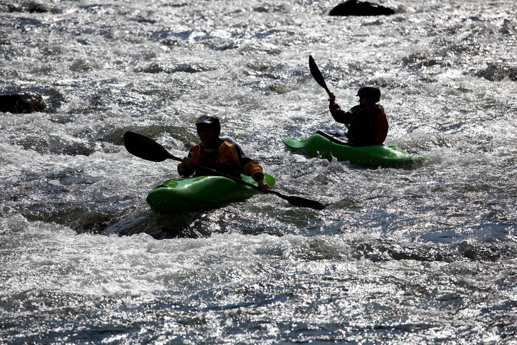 Kayaking in white water in rapids on river, Philippines