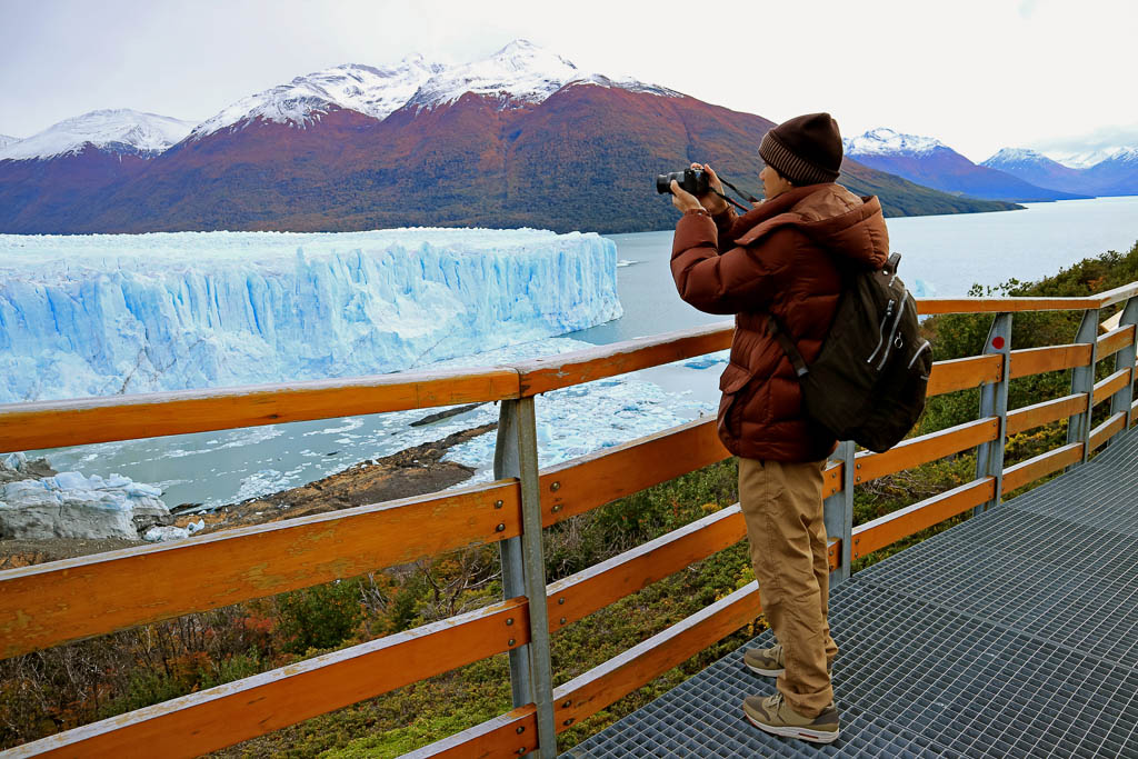 Man Shooting Photos of Perito Moreno Glacier from the Boardwalk in the Los Glaciares National Park, El Calafate, Patagonia, Argentina, South America