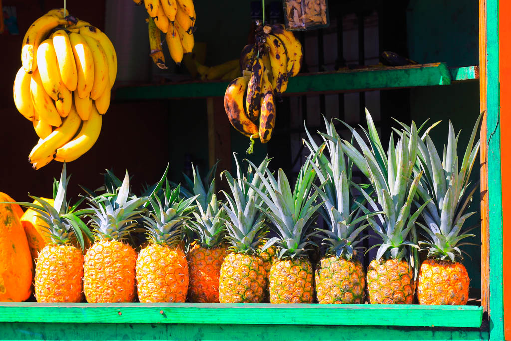 Pineapple and bananas Tropical fruits rustic street market detail, latin America exoticism