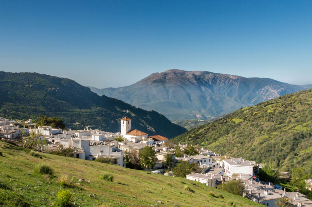 In the Sierra Nevada many villages can be found, of which the houses are all white. These houses have chimneys that are typical for the region Alpujarras, part of the mountain range of the Sierra Nevada. The village on the photo is Trévelez,
