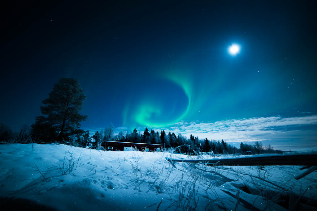 Beautiful northern lights aurora borealis in Lapland during the arctic night, Finland.