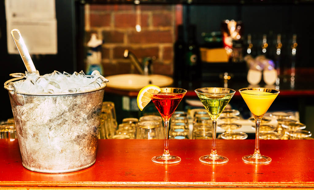 This pic shows gin tonic cocktails in glasses on bar counter in pup. The pic is taken in september 2019.