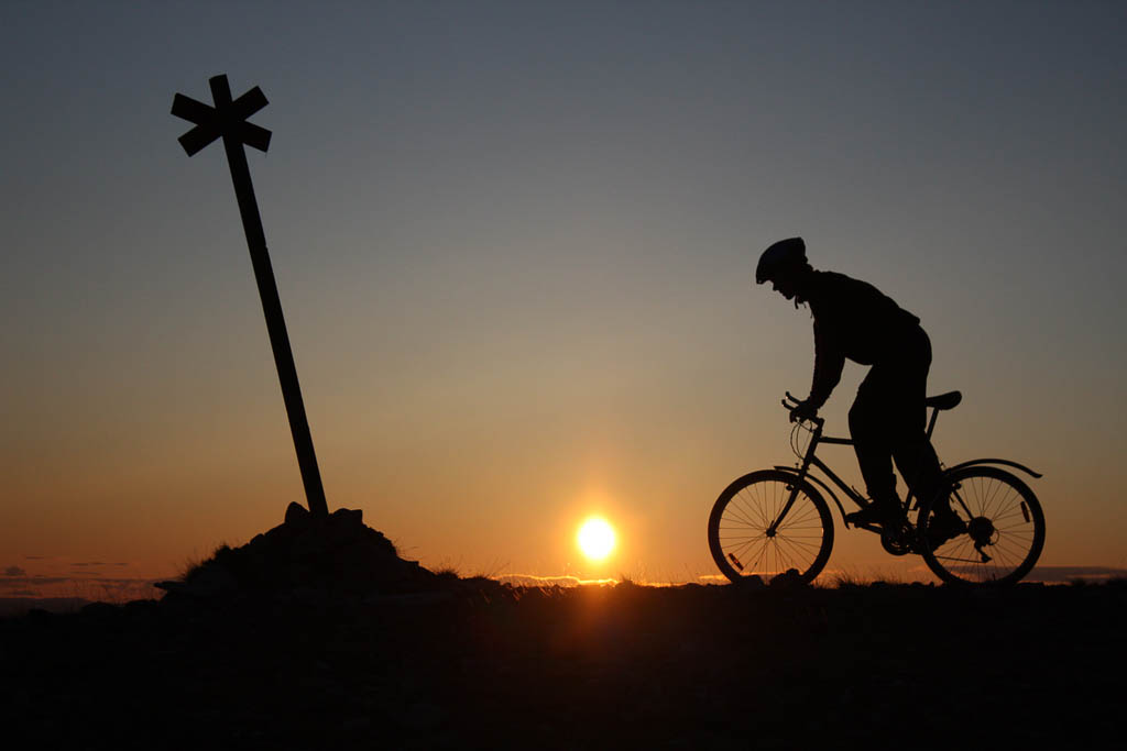Bicycling middle of the night on the summit of Yllas mountain, North Finland.