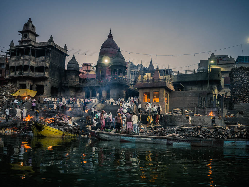 Bodies of dead people being cremated at the pyres of the Manikarnika ghat in Varanasi India. This is one of the oldest ghats of the city and the only one with Harishchandra were bodies are cremated according to the hindu tradition and their ashes and remains thrown to the Ganges river. If a person dies in Varanasi it is believed that it attains Moksha and is free of the cycle of reincarnation. Sadhus, pregnant women, children and those that have dies because of the bite of a cobra are considered pure and their remains don't need to be burned so they are immersed into the river with a weight.