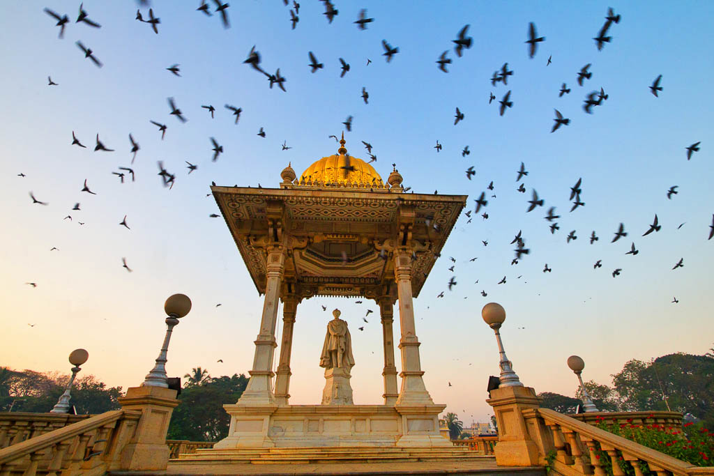 This scene can be witnessed every morning at the gate side of Mysore palace, Thousands of pigeons flock here everyday. It is even more beautiful to see the bird lovers gathering here to feed the pigeons. The Amba Vilasa Palace – Mysore. Karnataka.