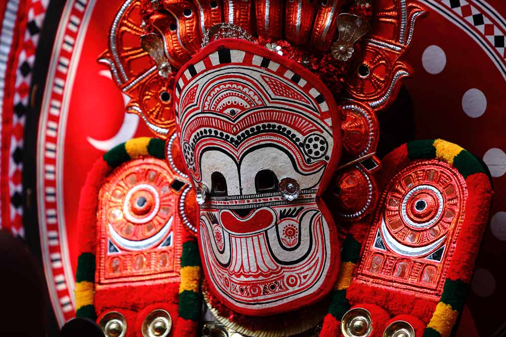 Theyyam performer with beautiful Mask