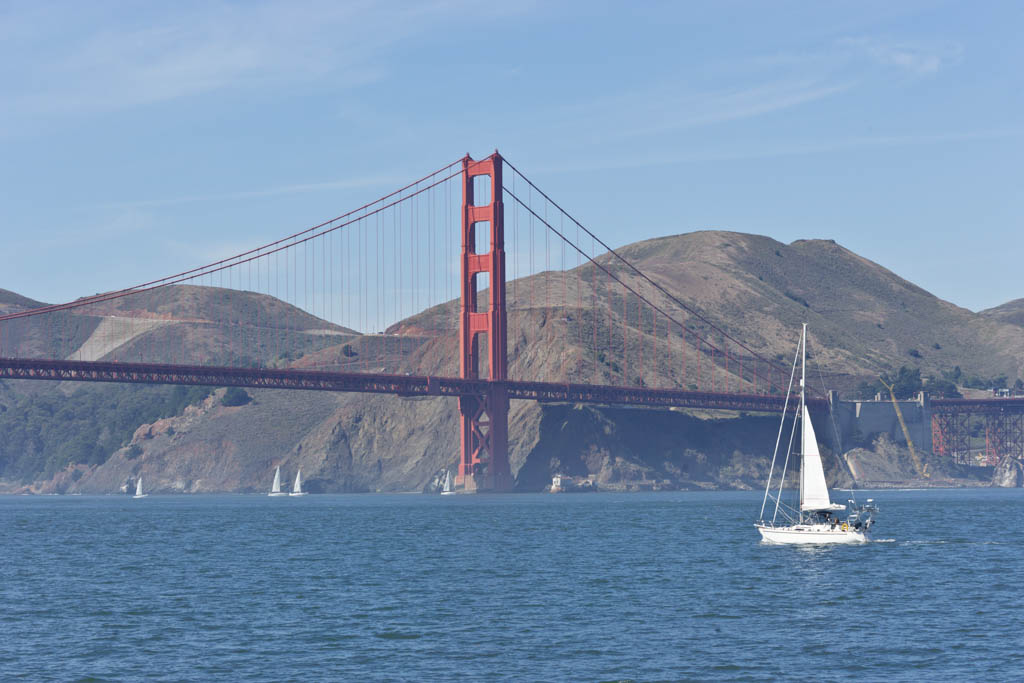 The golden gate bridge in San Francisco with a sailing boat in front. XXL size image.