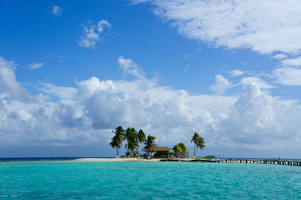 Photo of a idyllic tropical island surrounded by sea.