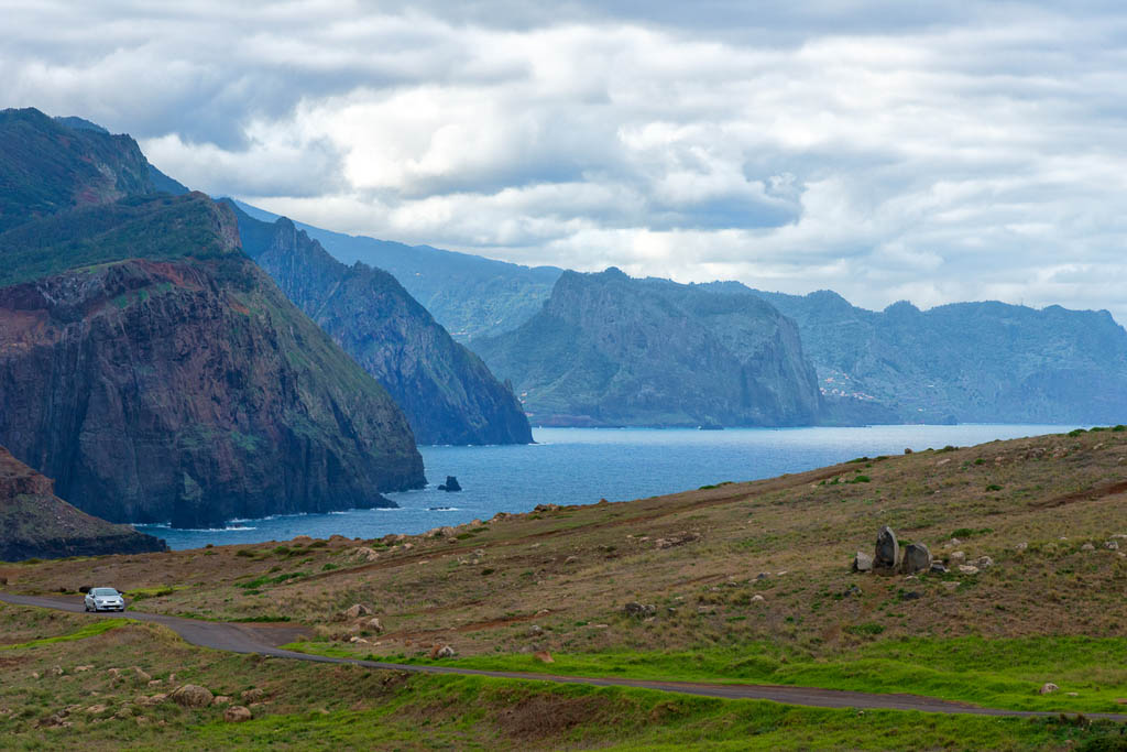 view to the cliffs of east Madeira with street and car