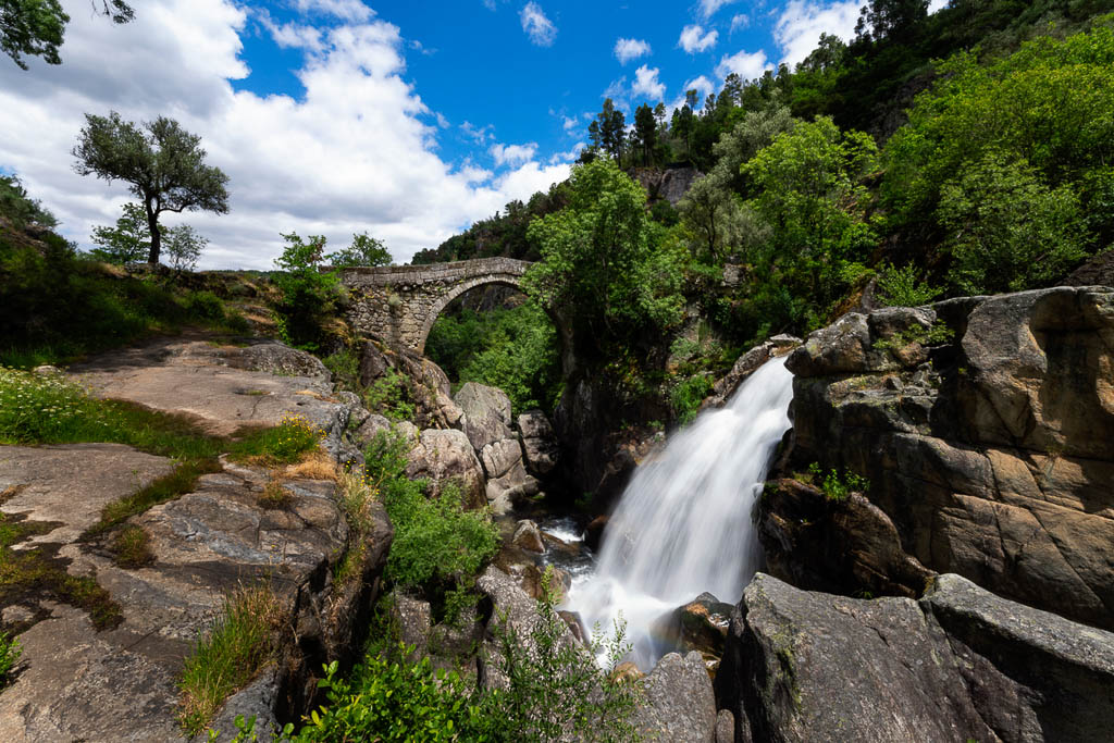 View of the Mizarela Bridge with a waterfall at the Peneda Geres National Park in Portugal