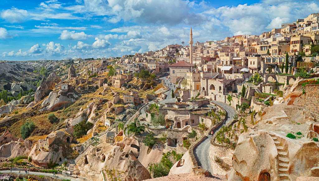 View of ancient Nevsehir cave town and a castle of Uchisar dug from a mountains in Cappadocia, Central Anatolia,Turkey.