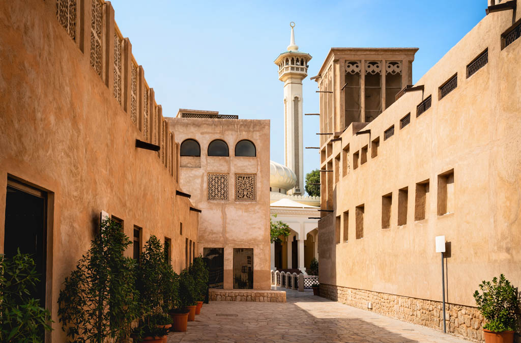 Old Dubai view with mosque, buildings and traditional Arabian street. Historical Al Fahidi neighbourhood, Al Bastakiya. Heritage district in United Arab Emirates (UAE).