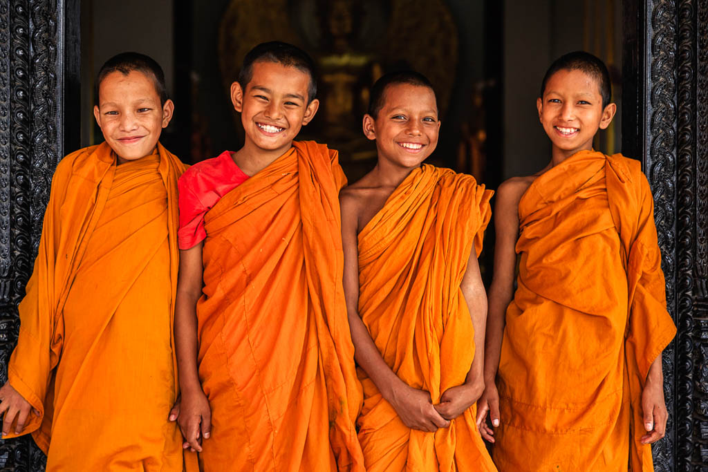 Group of happy Novice Buddhist monks in doors in the monastery in Bhaktapur, Nepal