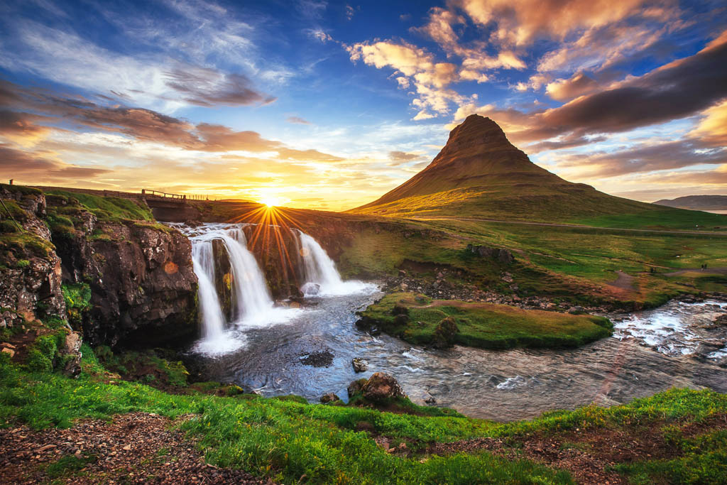 The picturesque sunset over landscapes and waterfalls. Kirkjufell mountain,Iceland