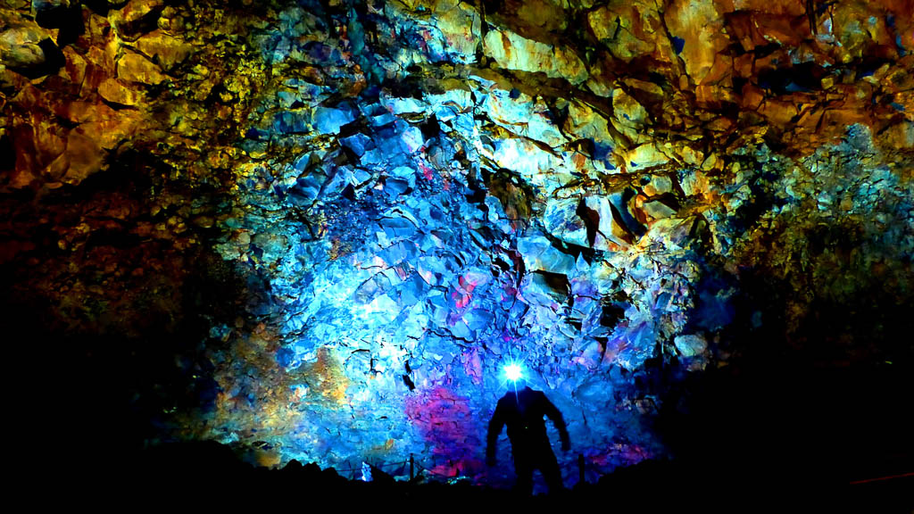 Hike-Inside-Thrihnukagigur-Volcanic-Crater-Iceland Inside the Volcano: Colorful magmatic stones (Mid Ocean Ridge Basalt) iluminated by artificial light inside the dead volcano "Thrihnukagigur" in Iceland (May 2015)