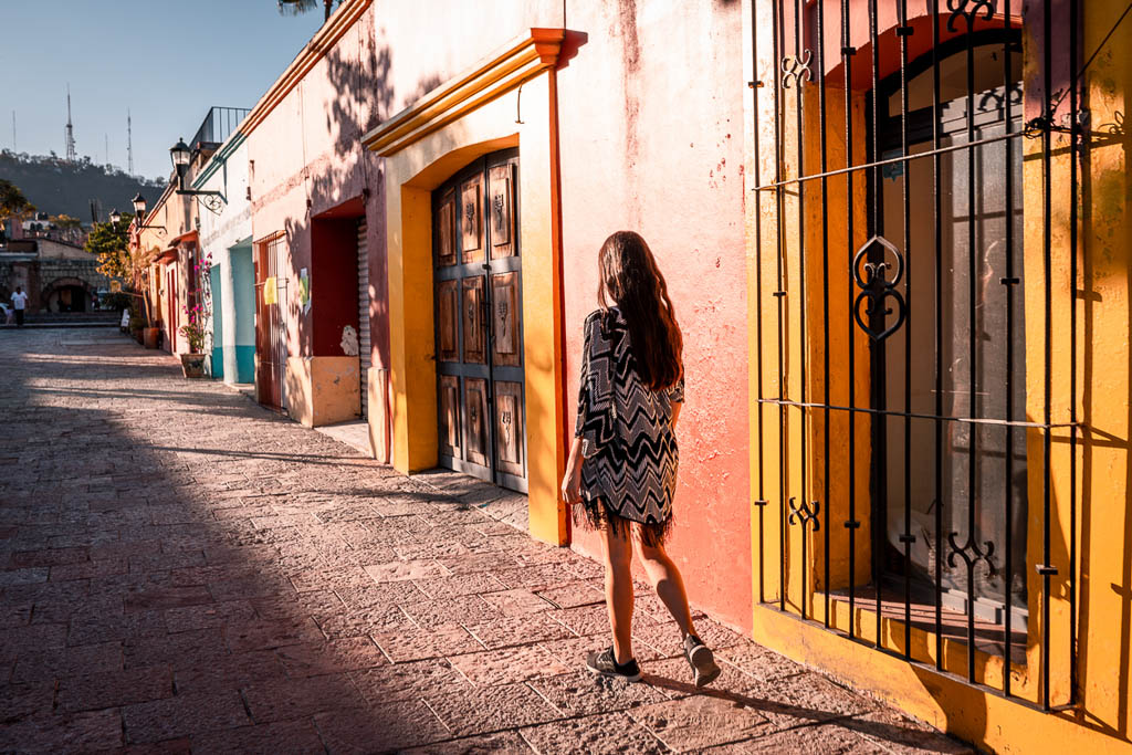 Young woman walking the streets of Oaxaca city