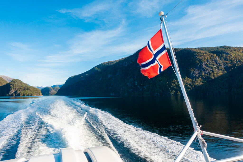 Norway flag on Ferry cruise with blue sky