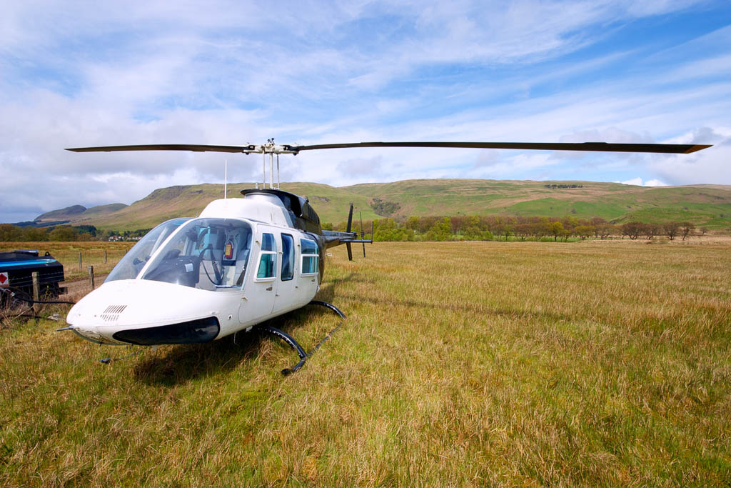 A private charter helicopter awaiting passengers for a scenic tour of the west of Scotland.