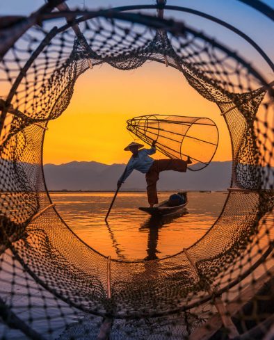Fishermen sihouettes at Inle lake on sunset, Myanmar