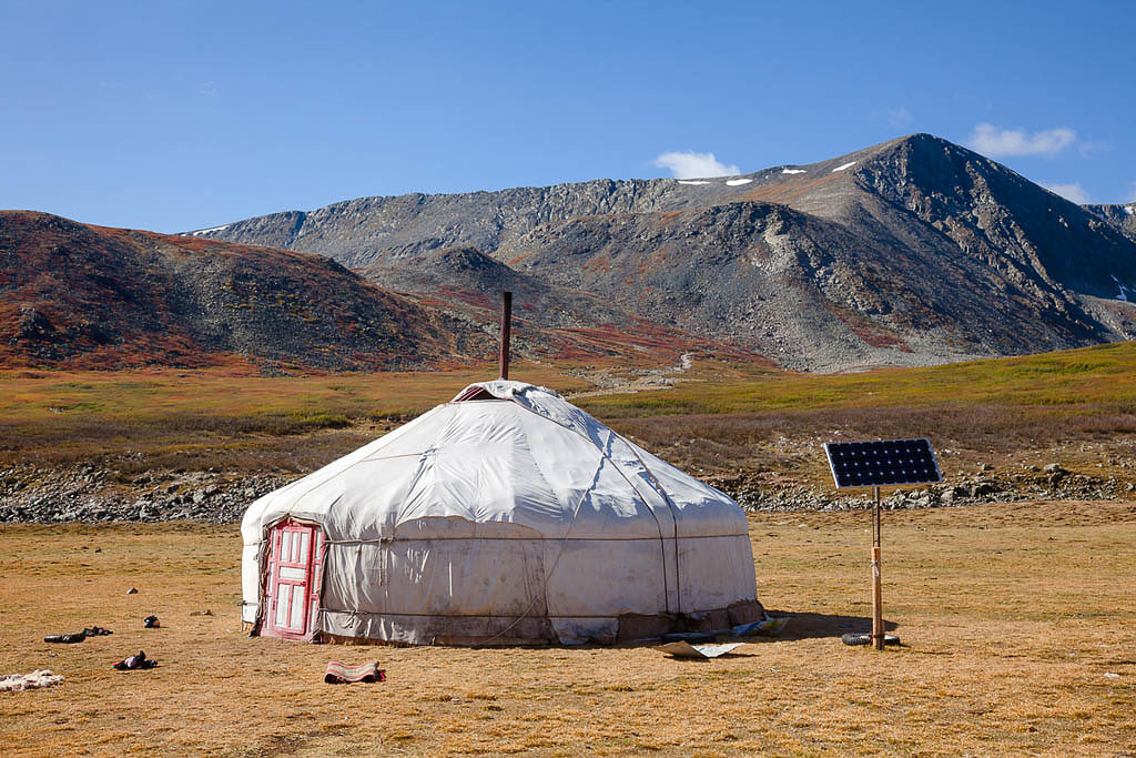 Traditional Mongolian portable round tent ger covered with white outer cover powered by solar panel in Altai Mountains of Western Mongolia