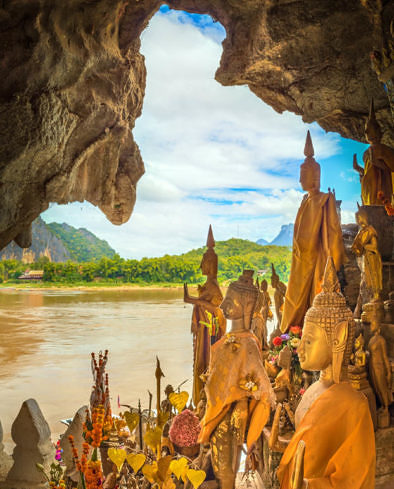 View from the Pak Ou cave. Buddha statue on the foreground. Luang Prabang. Laos.